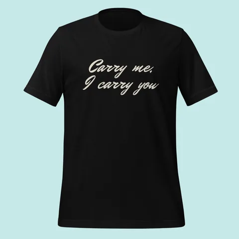 Black tee with "Carry me, I carry you" hand-signed across the chest