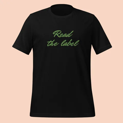 Black tee with "Read the label" hand-signed across the chest